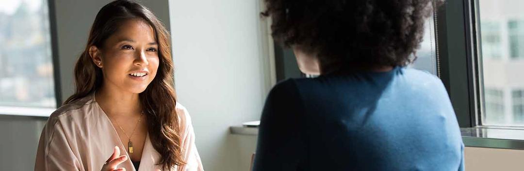 women speaking to each other
