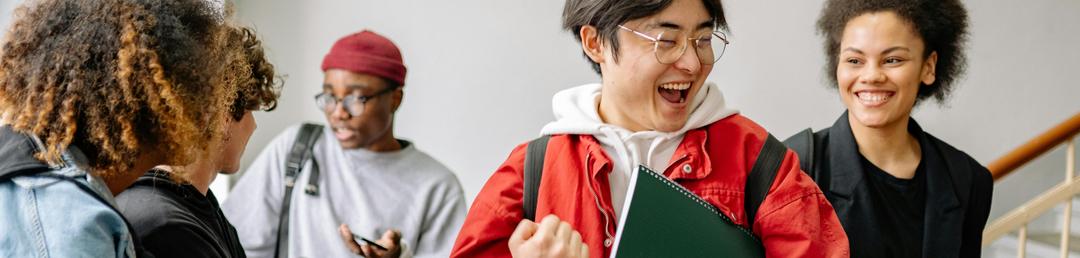 A group of IDP test takers taking a smiling together.