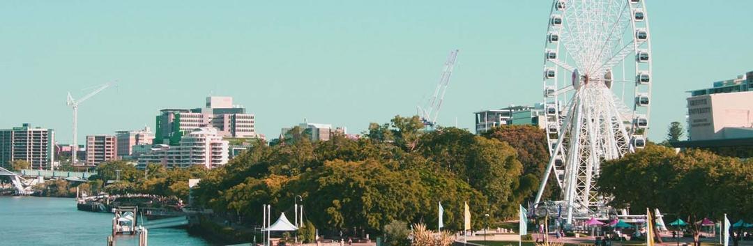 landscape of city with ferris wheel