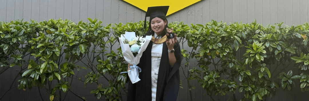 Faye holding s bokeh and the medal she got after acquiring a better career from IDPs Medibank Academy Internship.