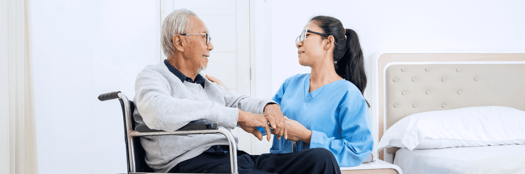 A medical student checking on elderly patient health