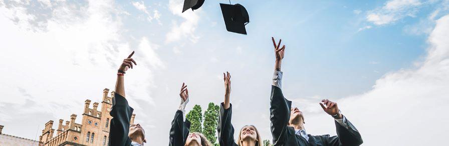 Graduate students throwing their hat