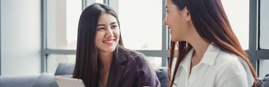 A woman students talking each other
