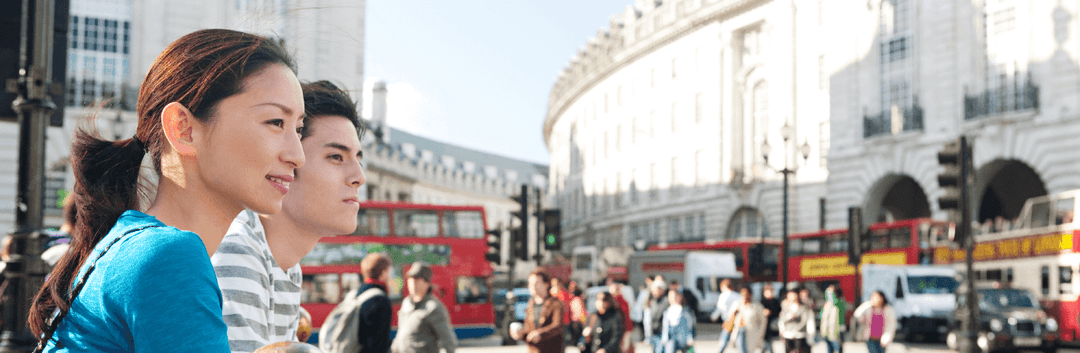 Two students look upon the UK busy street.