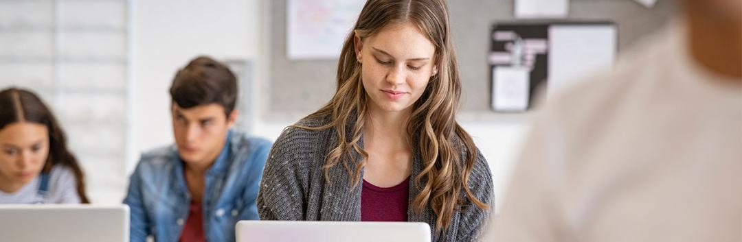 A female student working with her laptop