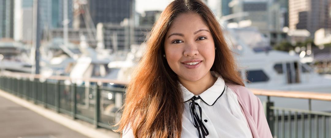 An international student smiling in a bridge